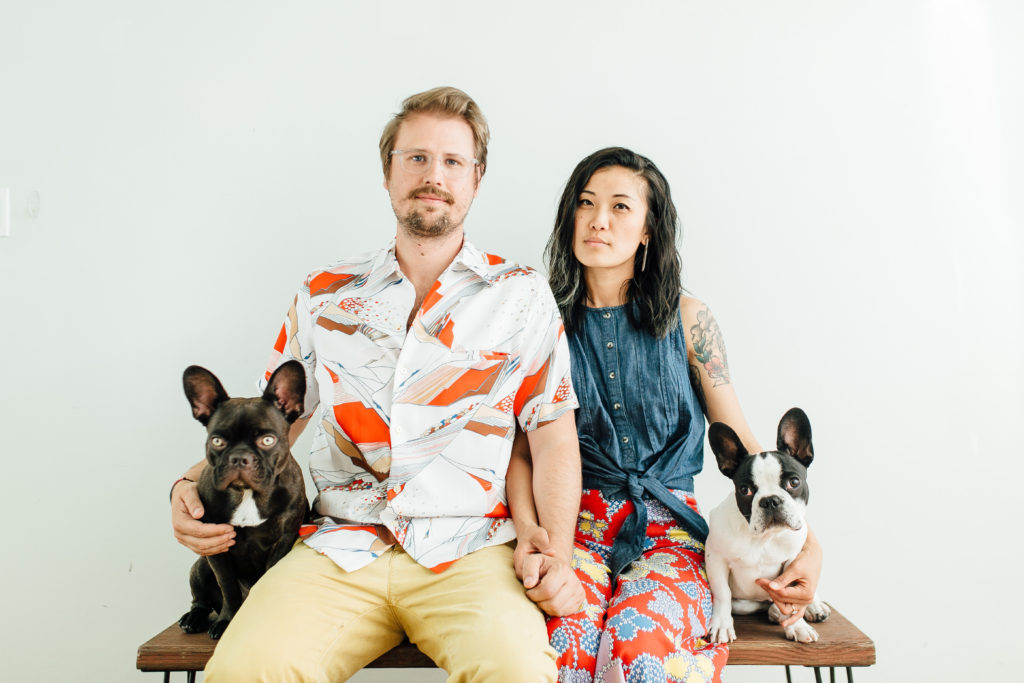 Engagement photo of Natasha, Dylan, and dogs at 85b studio