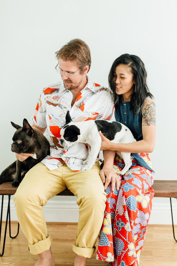 Engagement photo of Natasha, Dylan, and dogs at 85b studio