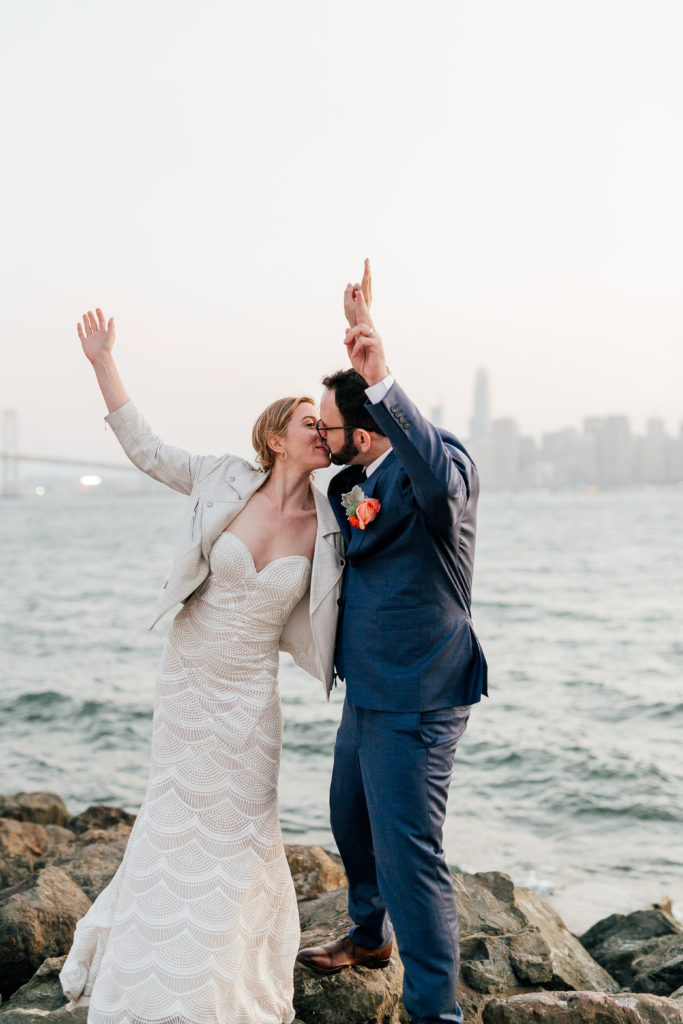 Bride and Groom's Modern Wedding Treasure Island with San Francisco in the background