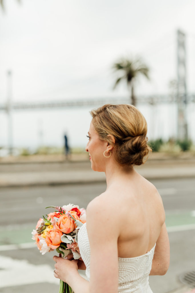 Bride getting ready for first look by the Bay Bridge