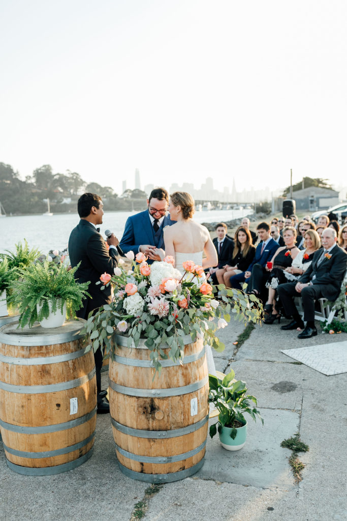 Bride and Groom on Treasure Island with the Bay Bridge in the background