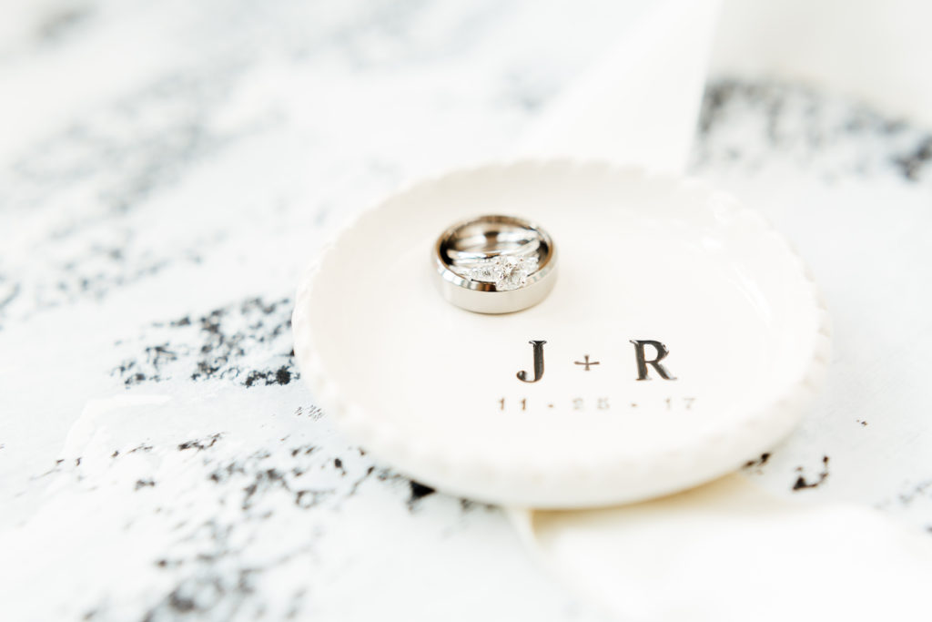 wedding rings sit on top of custom small plate