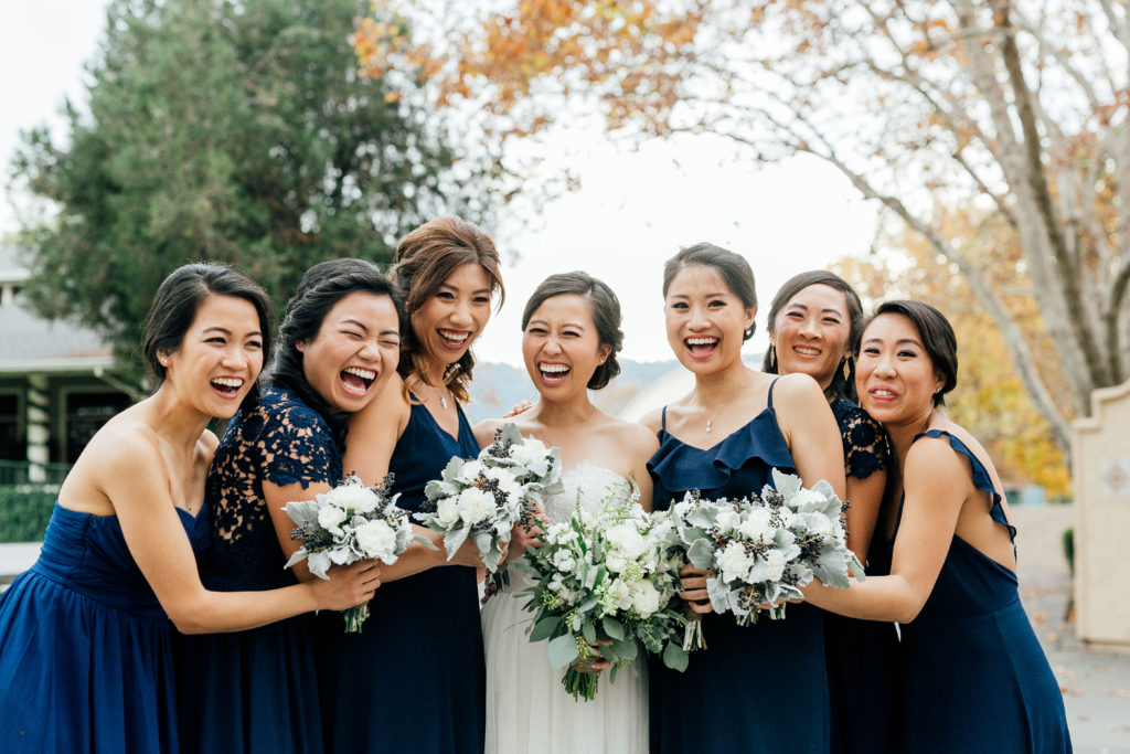 bride smiling with all bridesmaids