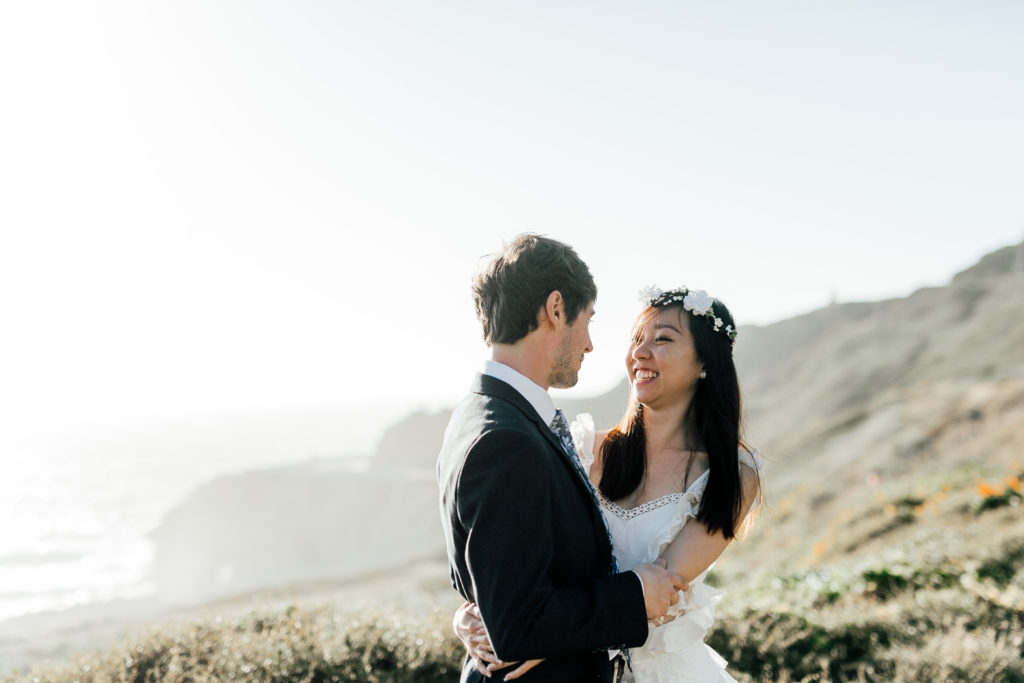 Couple looks lovingly into each other's eyes at Sutro Baths