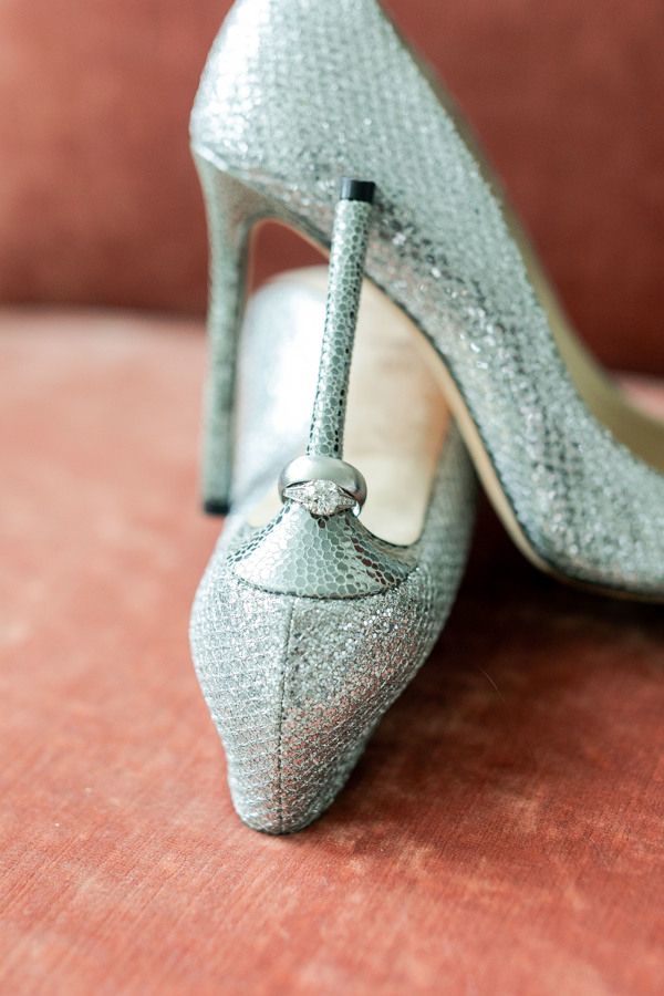 Sharon and John's wedding rings sling from her stiletto heel.