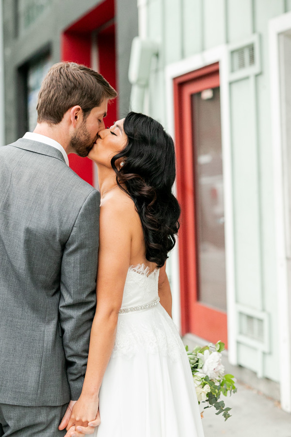 The bride and groom kiss before their San Francisco ethical wedding