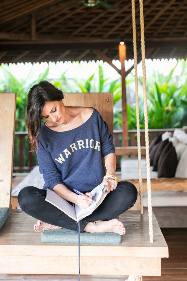 Janel Broderick sits in a hut in Bali writing thoughts about her new business.