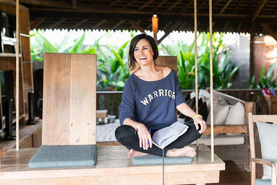 Janel sits with her journal during her professional branding photoshoot with Comeplum in Bali.